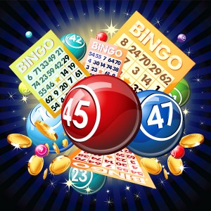 Bingo balls and cards on golden background